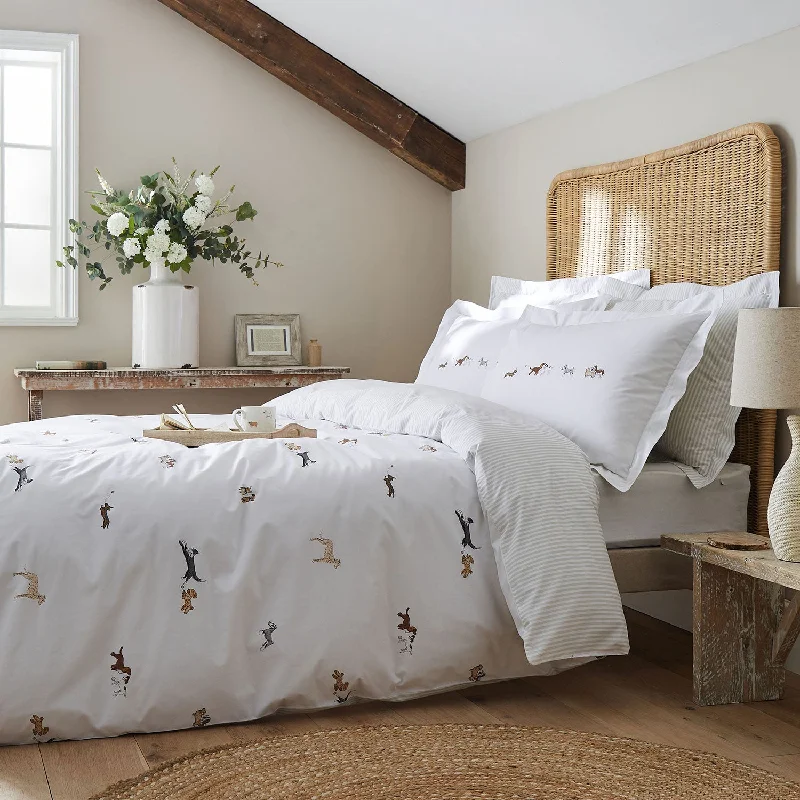 Moisture - wicking duvet covers to prevent night sweatsSophie Allport Doggy Day Care Off-White Duvet Set